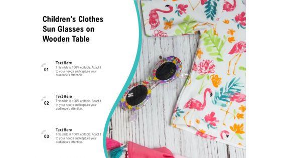 Childrens_Clothes_Sun_Glasses_On_Wooden_Table_Ppt_PowerPoint_Presentation_Pictures_Rules_PDF_Slide_1.jpg