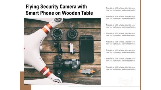Flying Security Camera With Smart Phone On Wooden Table Ppt PowerPoint Presentation File Topics PDF